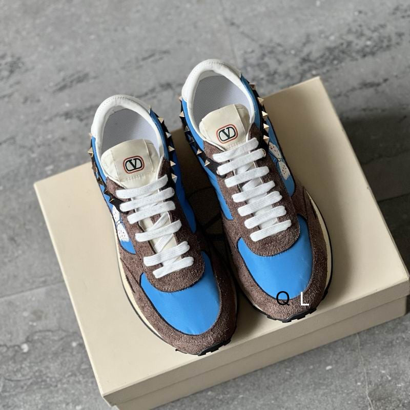 Valentino Garavani Rockstud Runner Sneaker in Blue and Brown, top view on box