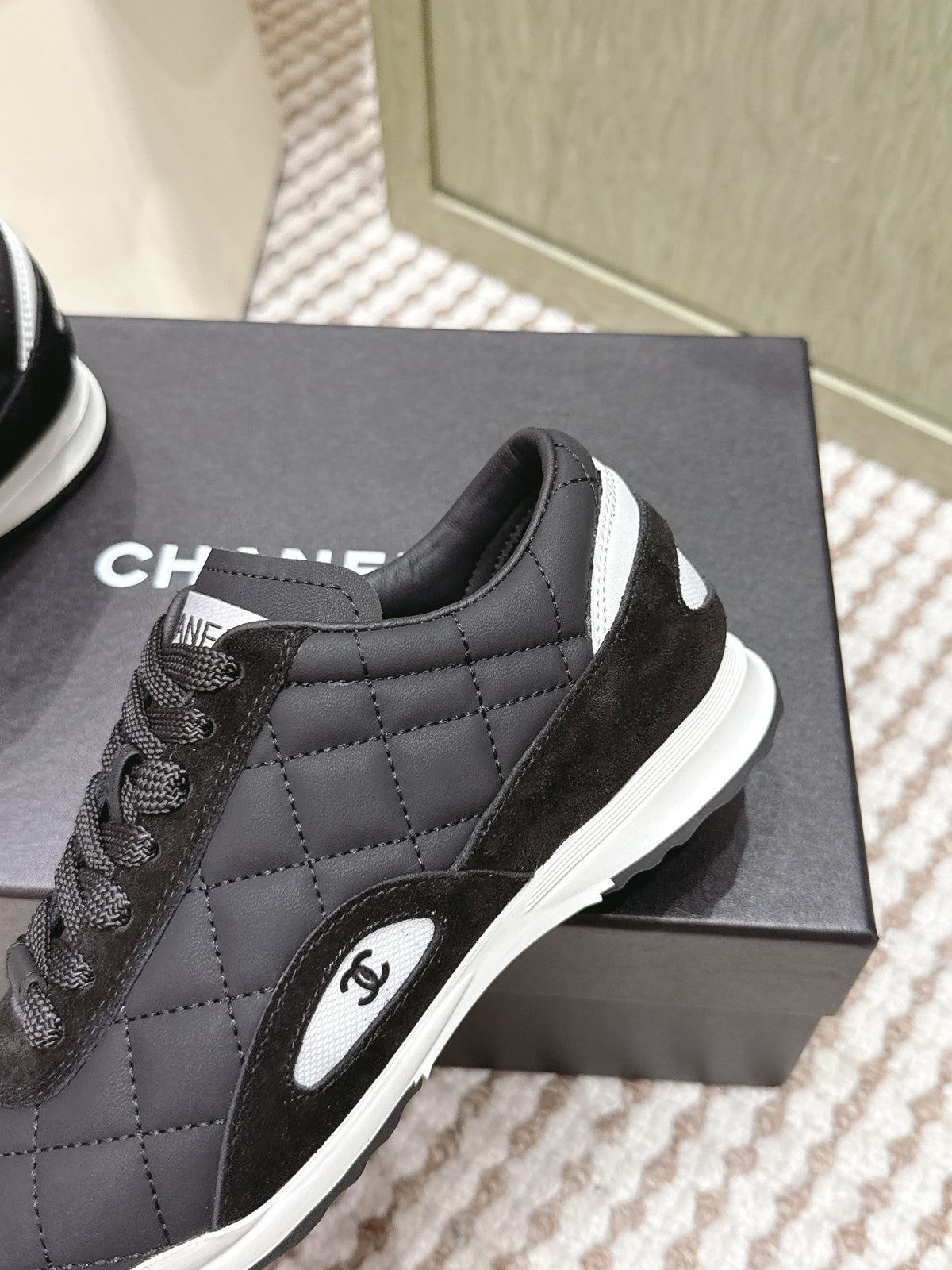 CHANEL 25S SNEAKERS IN BLACK CALFSKIN AND SUEDE